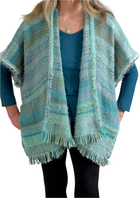Handwoven Boho style poncho in the Sea Shades